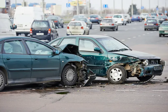 Two green cars crashed into each other