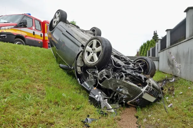 Car flipped over in a ditch