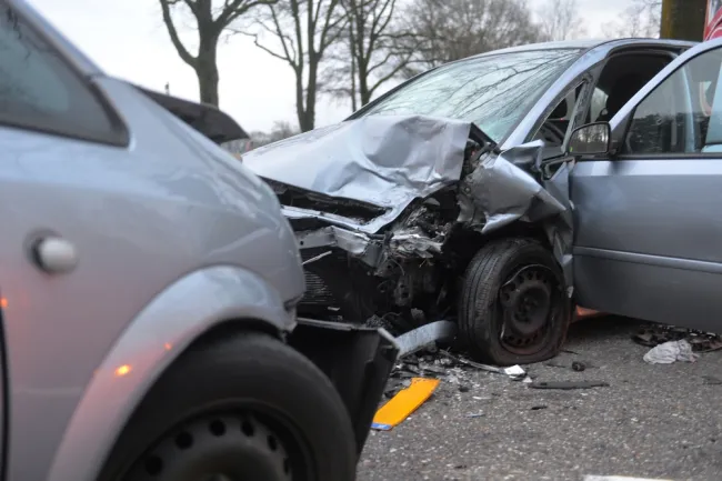 Two grey cars crashed into each other on a road