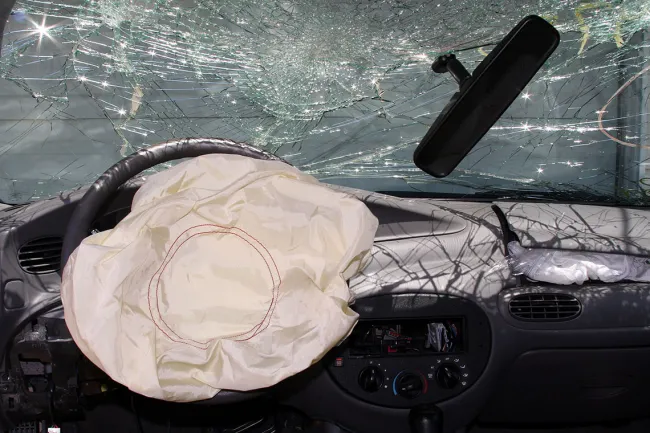 Takata Recall Expands By Another 35 Million Airbags: Here’s What You Should Do Next - An deployed airbag in a vehicle post-collision
