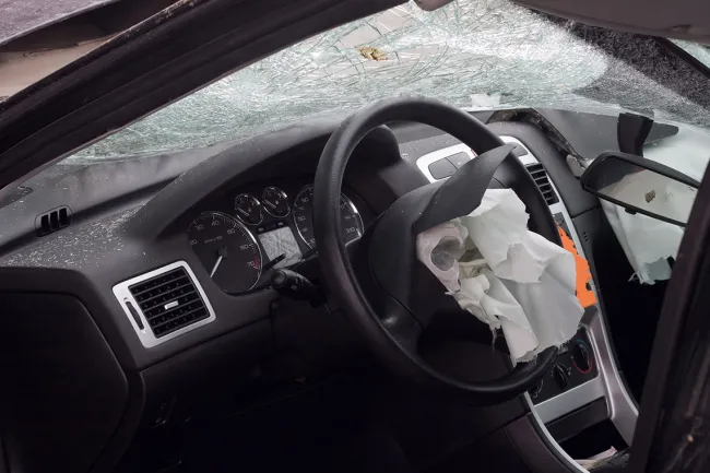 NHTSA Head Says Automakers Have “Ultimate Responsibility” for Airbag Repairs - The car's airbag deployed after a collision.