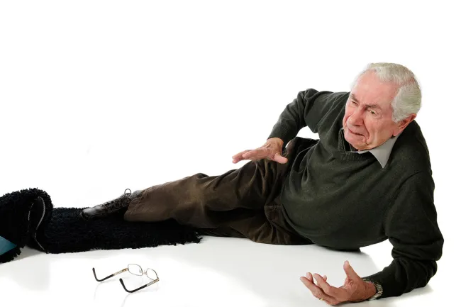 Elderly man fallen on his side