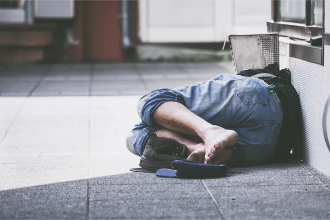 Homeless person on floor