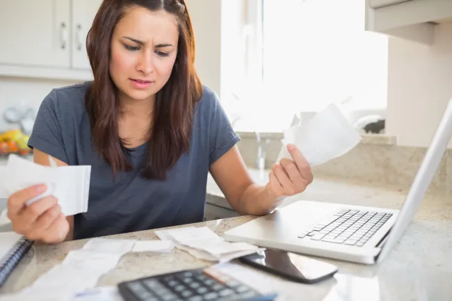 stressed woman looking at life insurance policy